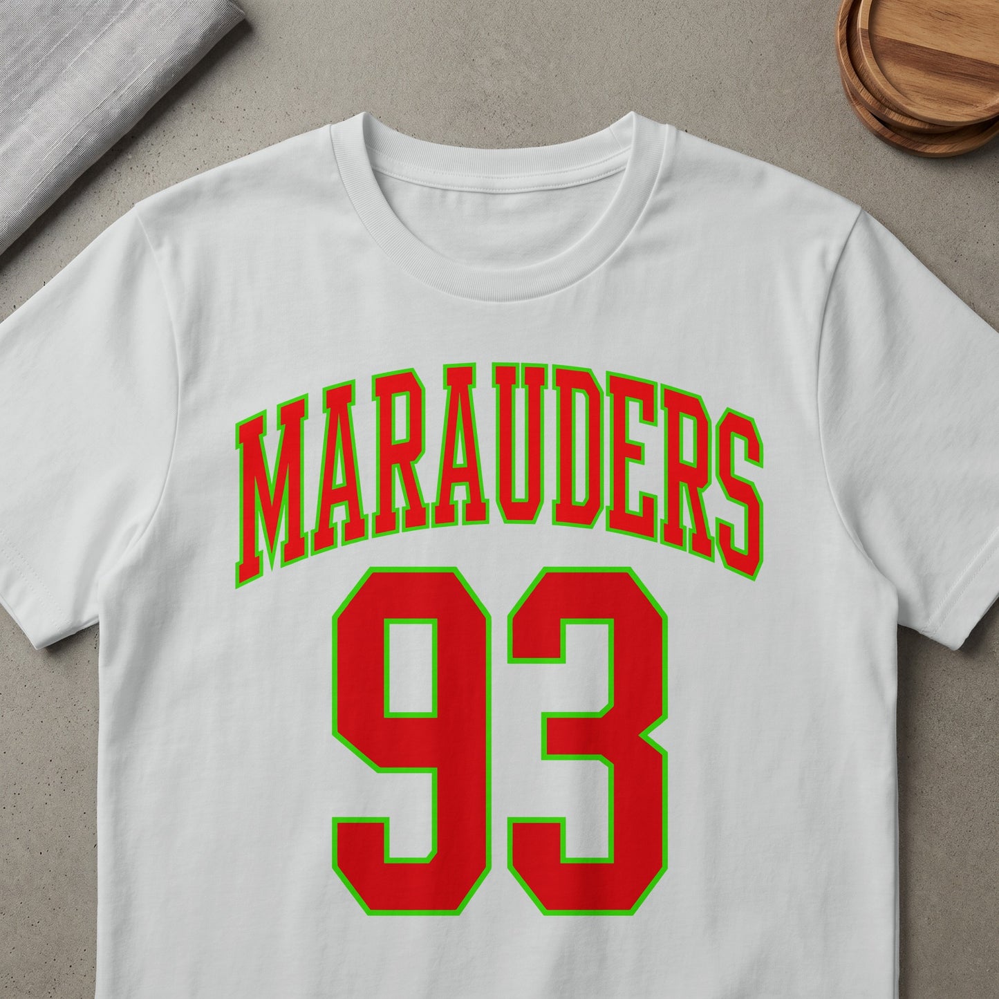 White t-shirt with "Marauders 93" in red and green lettering.