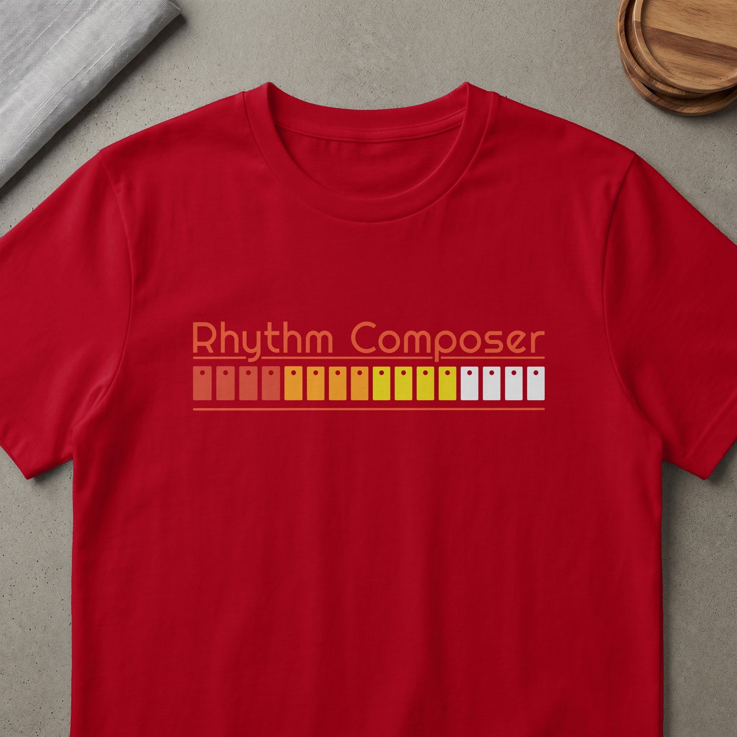 Red t-shirt with "Rhythm Composer" text and a colorful equalizer bar graphic.