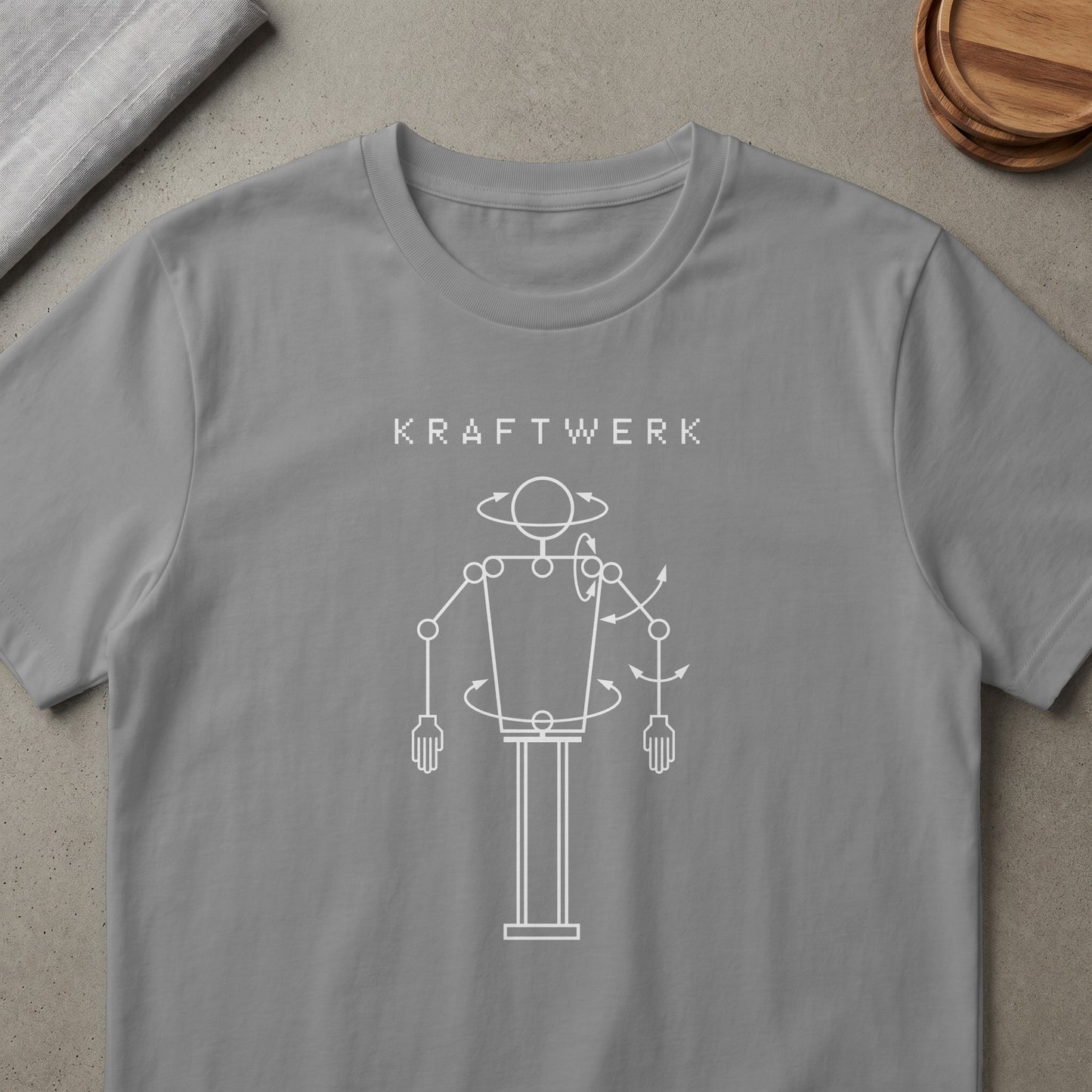 Kraftwerk logo with a white outline drawing of a robotic figure.