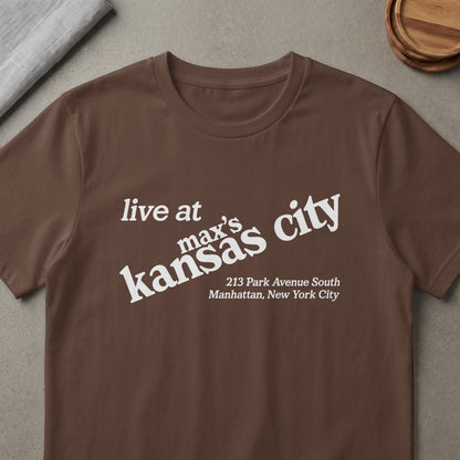 Brown t-shirt with white text "live at max's kansas city" and address.
