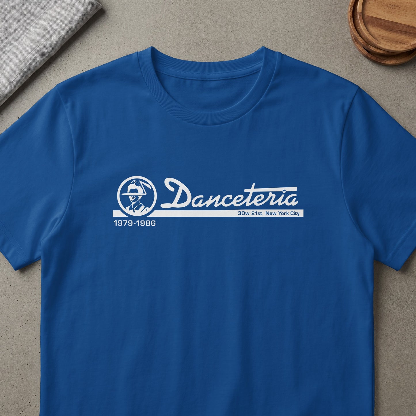 Royal blue t-shirt with white "Danceteria 1979-1986 30w 21st New York City" graphic.