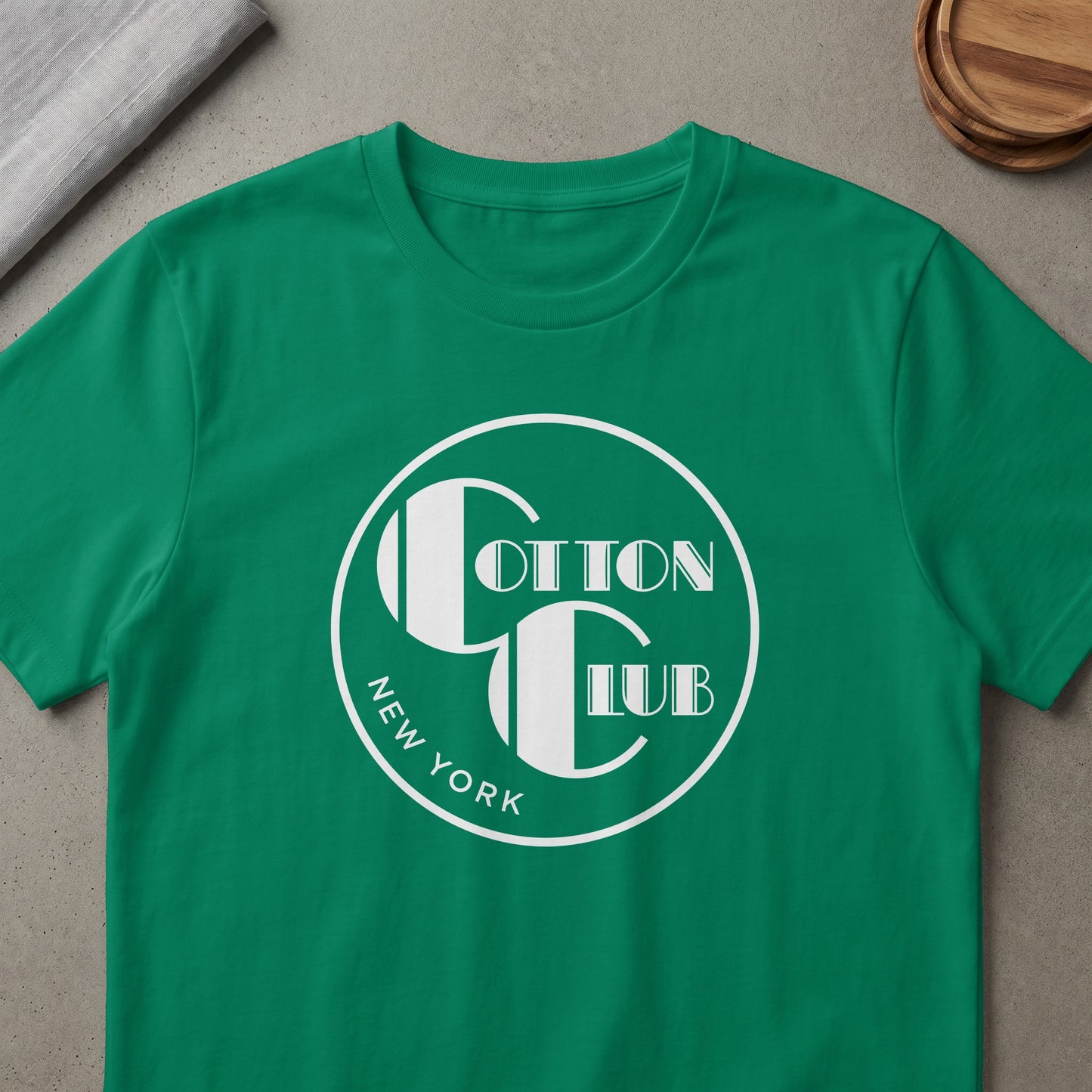 Green t-shirt with white Cotton Club New York logo.
