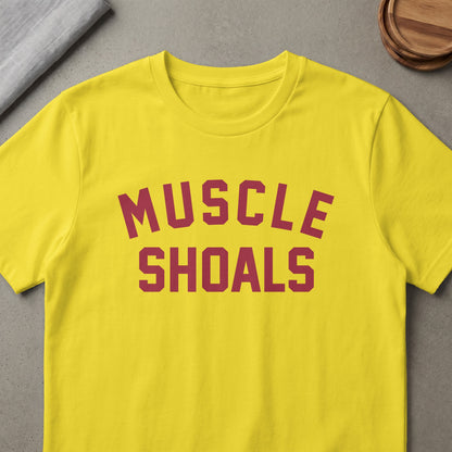 Yellow t-shirt with maroon "MUSCLE SHOALS" text.