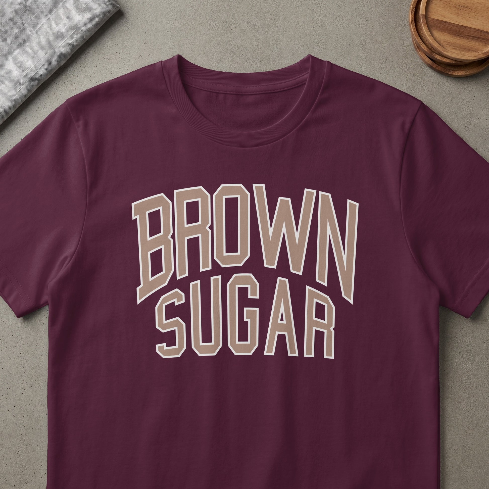 Burgundy t-shirt with "BROWN SUGAR" text in tan outline letters.