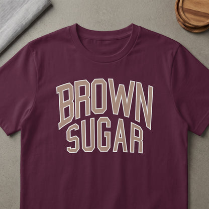 Burgundy t-shirt with "BROWN SUGAR" text in tan outline letters.