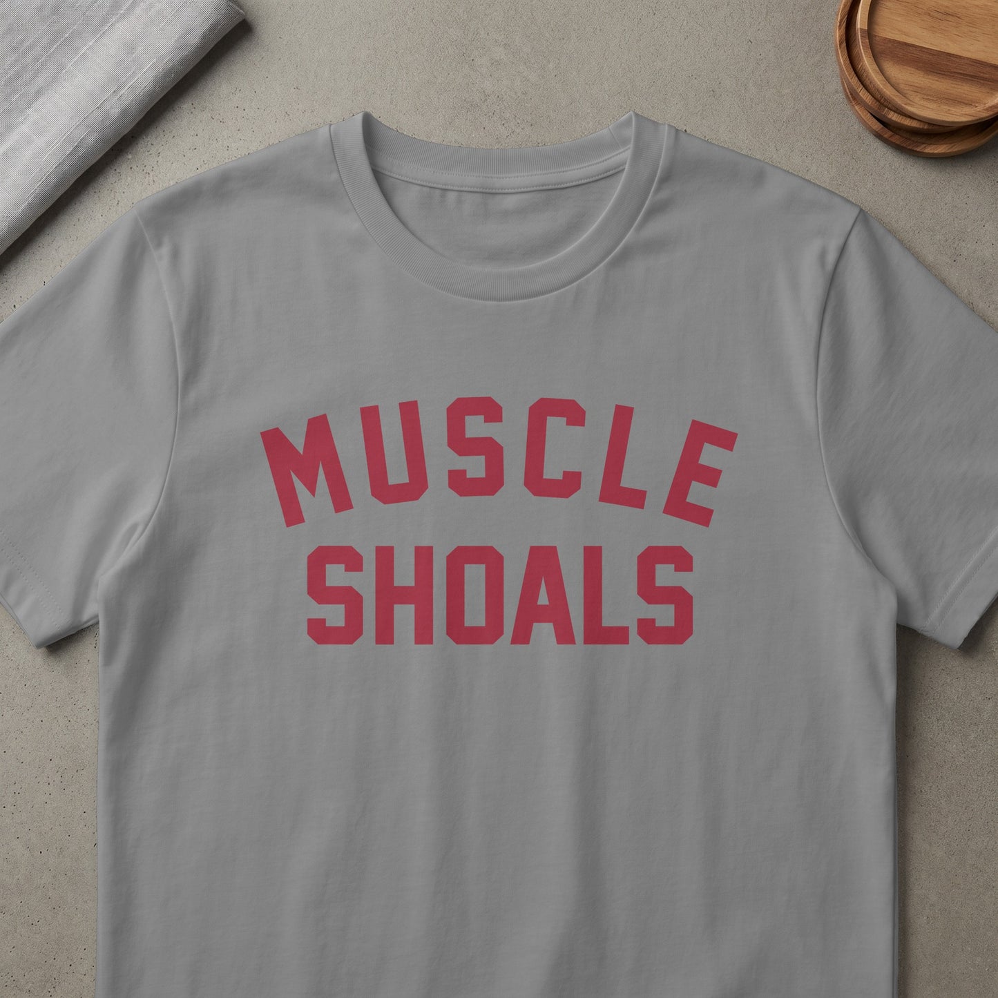 Grey t-shirt with red text reading "MUSCLE SHOALS".
