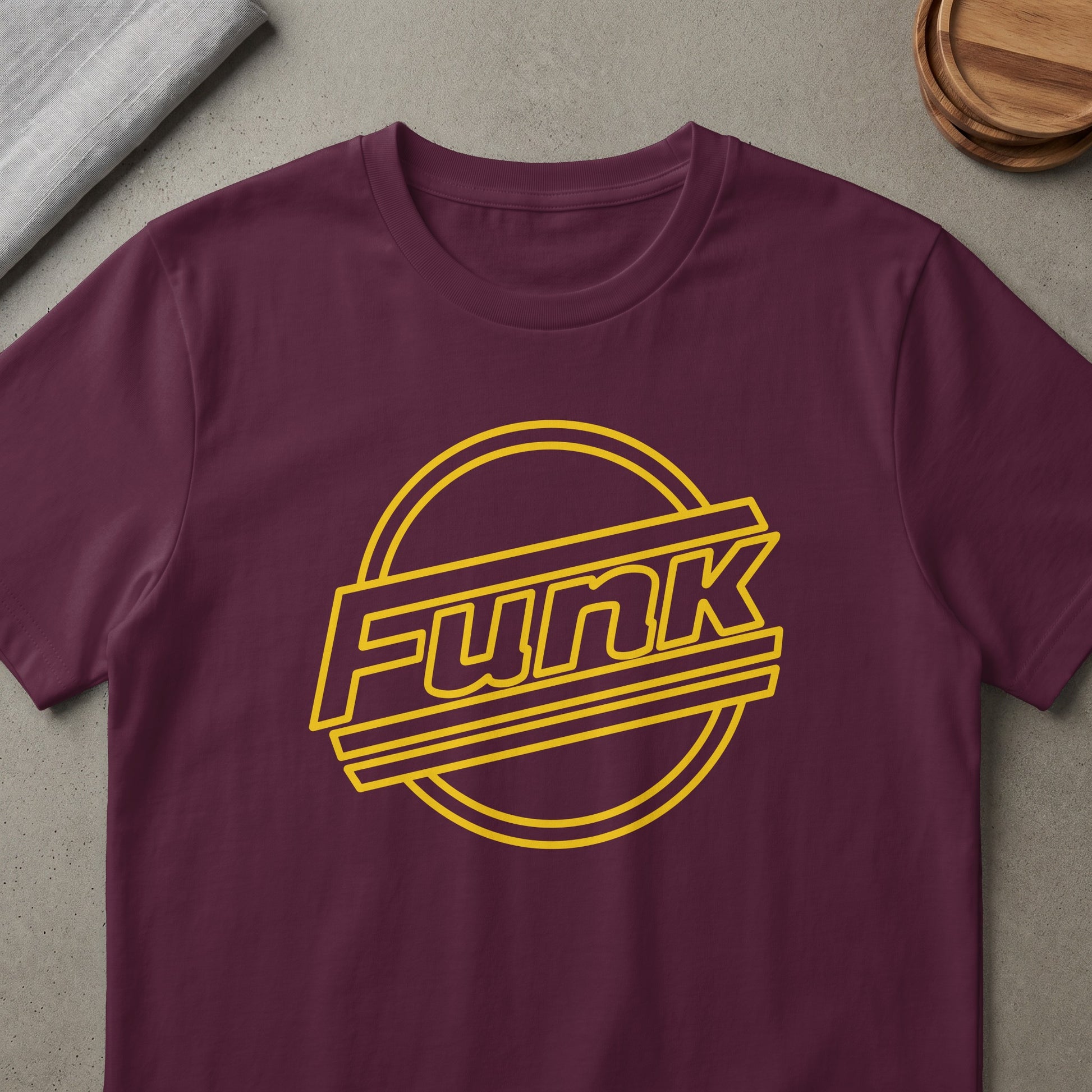 Maroon t-shirt with yellow "Funk" text inside a circular outline.