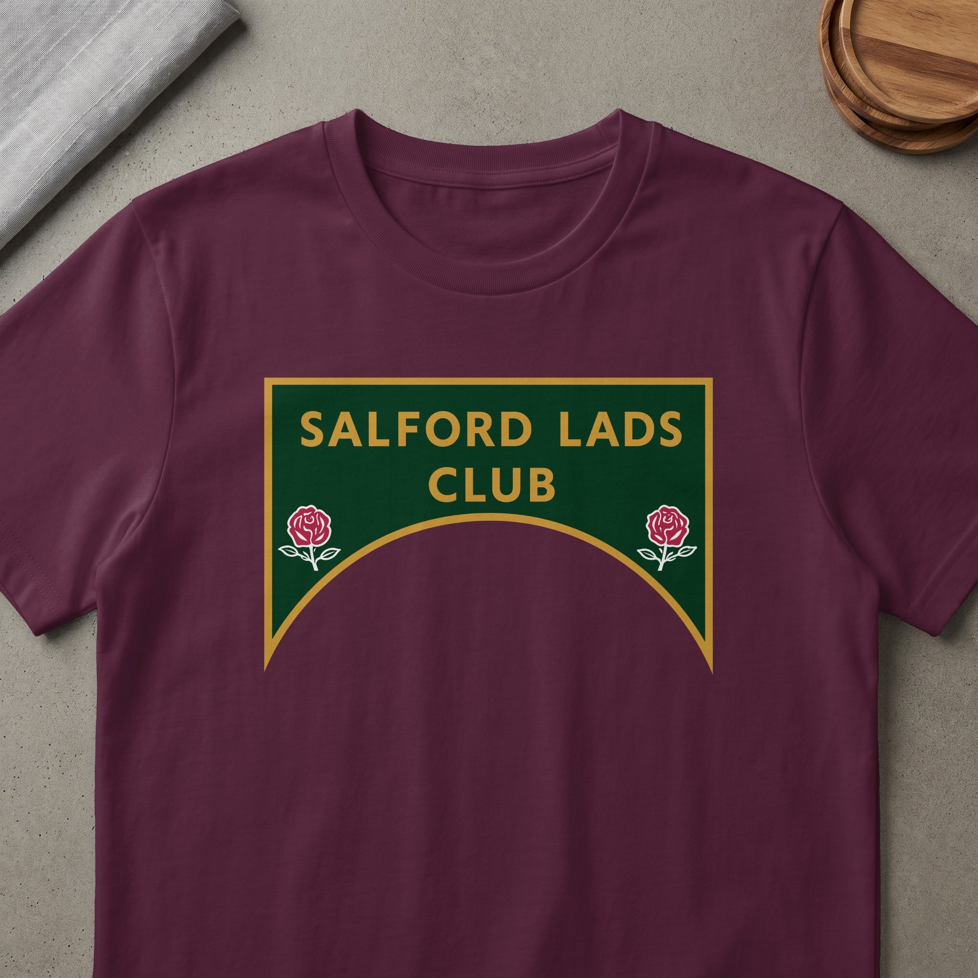 Maroon t-shirt with Salford Lads Club logo featuring roses.