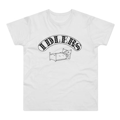 A white short-sleeved t-shirt featuring the word IDLERS in a curved, black, patterned font above a drawing of a person lying in bed.