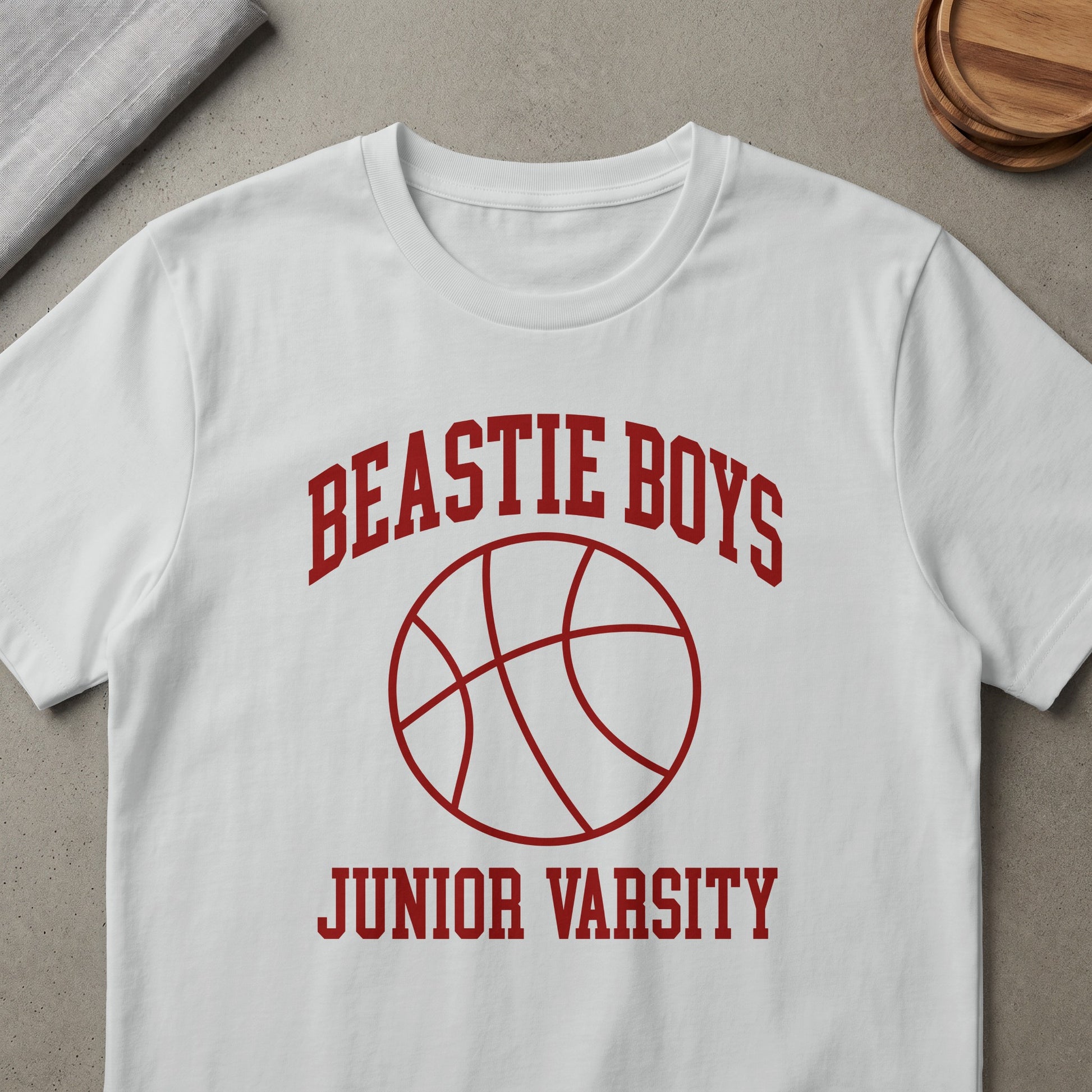 White t-shirt with red Beastie Boys Junior Varsity and basketball graphic.
