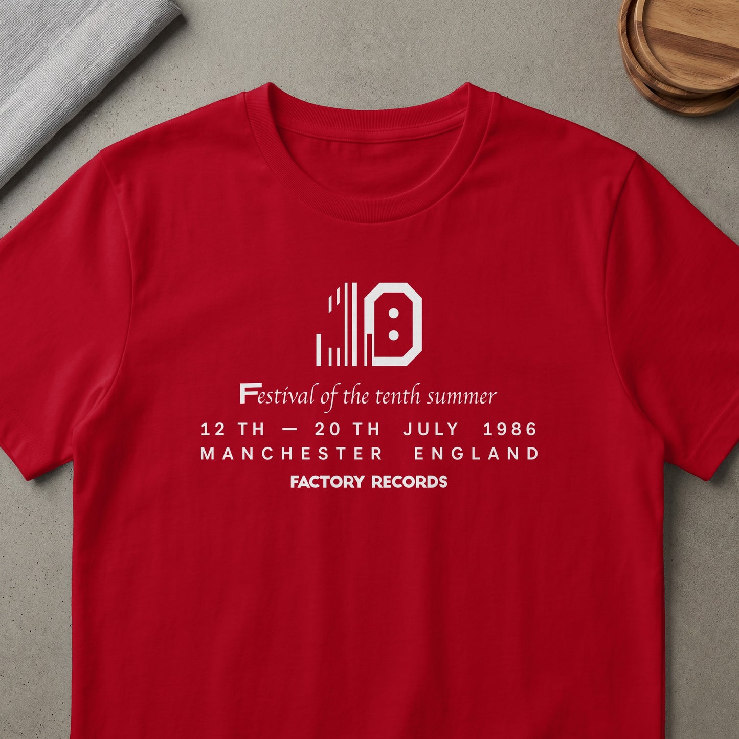 Red t-shirt with text Festival of the Tenth Summer, 12-20 July 1986, Manchester England, Factory Records.