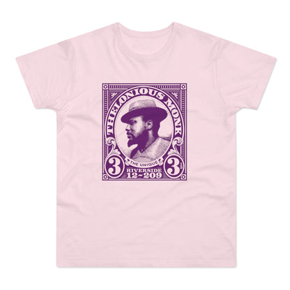 Thelonious Monk portrait graphic on a light pink t-shirt.