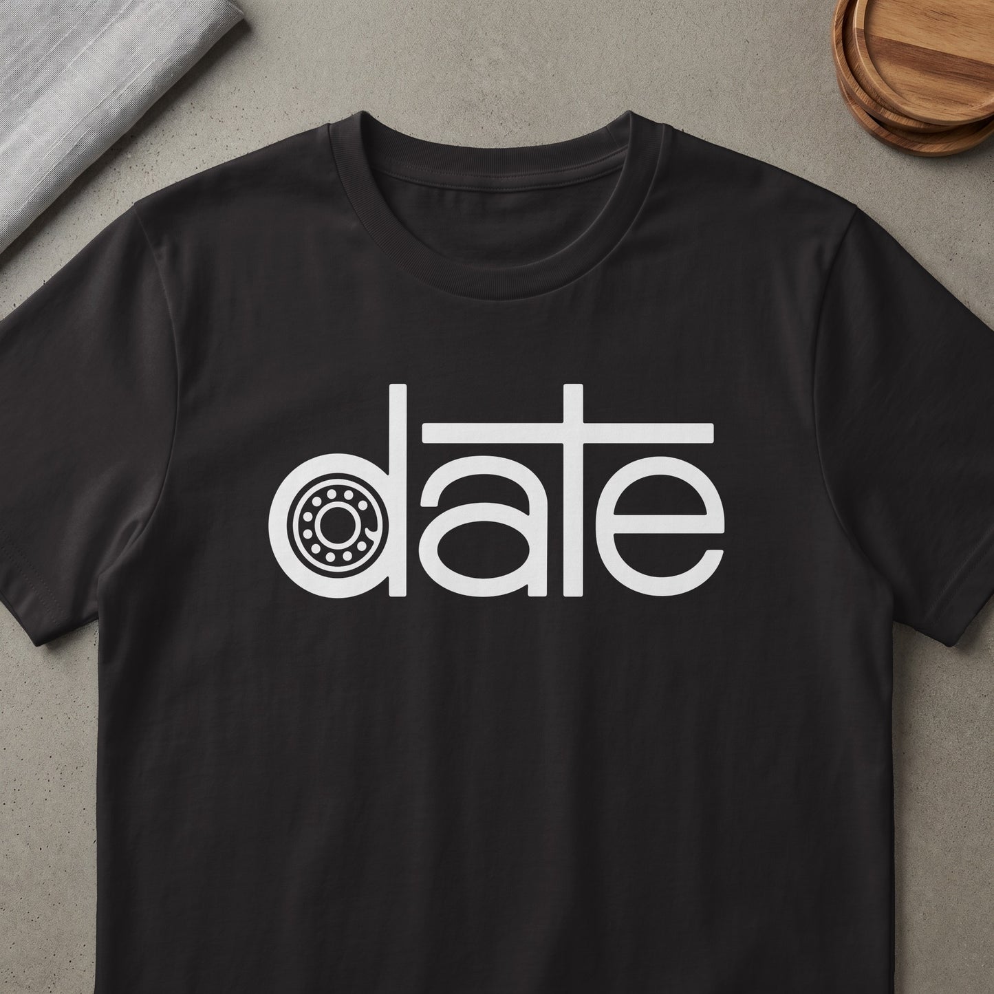 Black t-shirt with white text "date" featuring a bearing graphic.