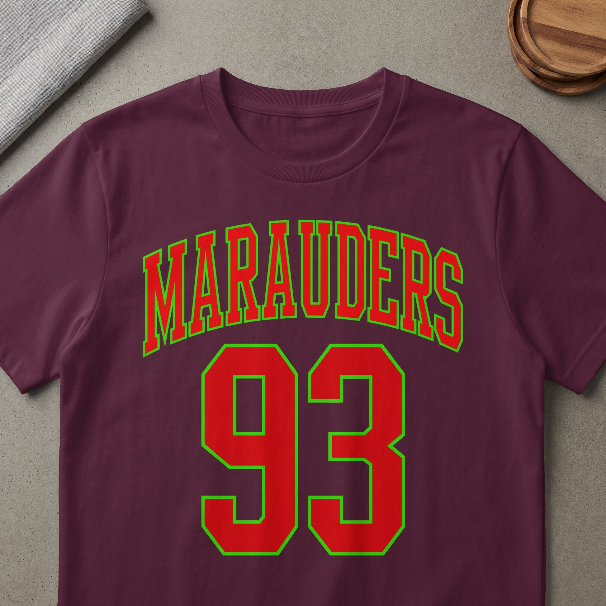 Marauaders 93 text on a burgundy t-shirt.