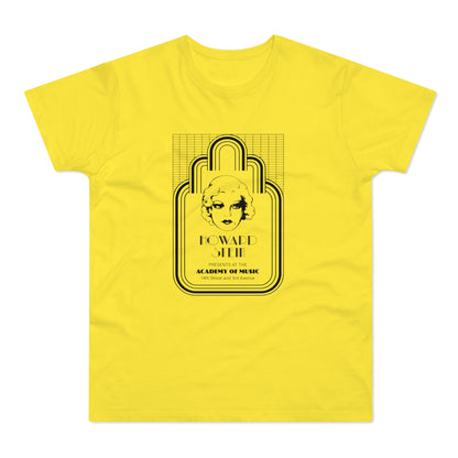 Yellow t-shirt with a black graphic of a woman's face, "Howard Stein," and "Academy of Music."
