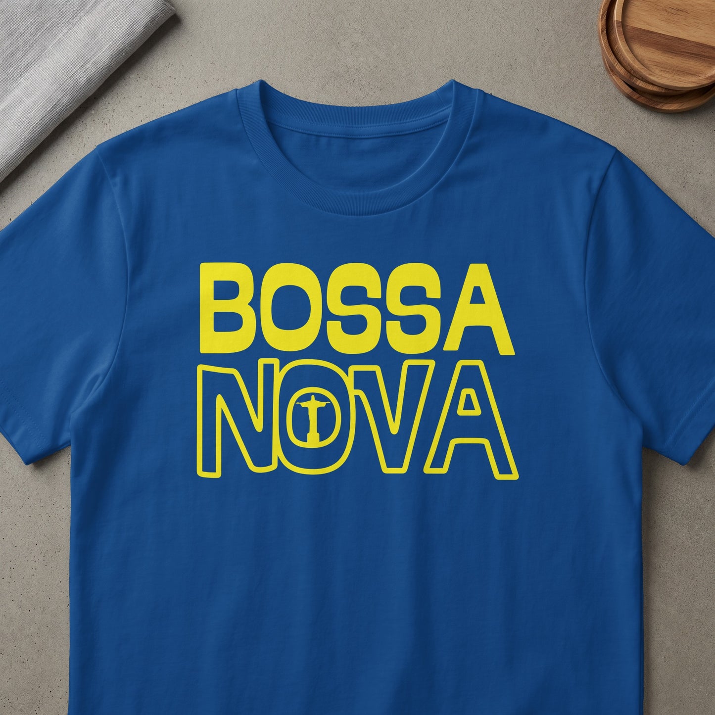 Blue t-shirt with yellow "BOSSA NOVA" text and Christ the Redeemer icon in the "O".