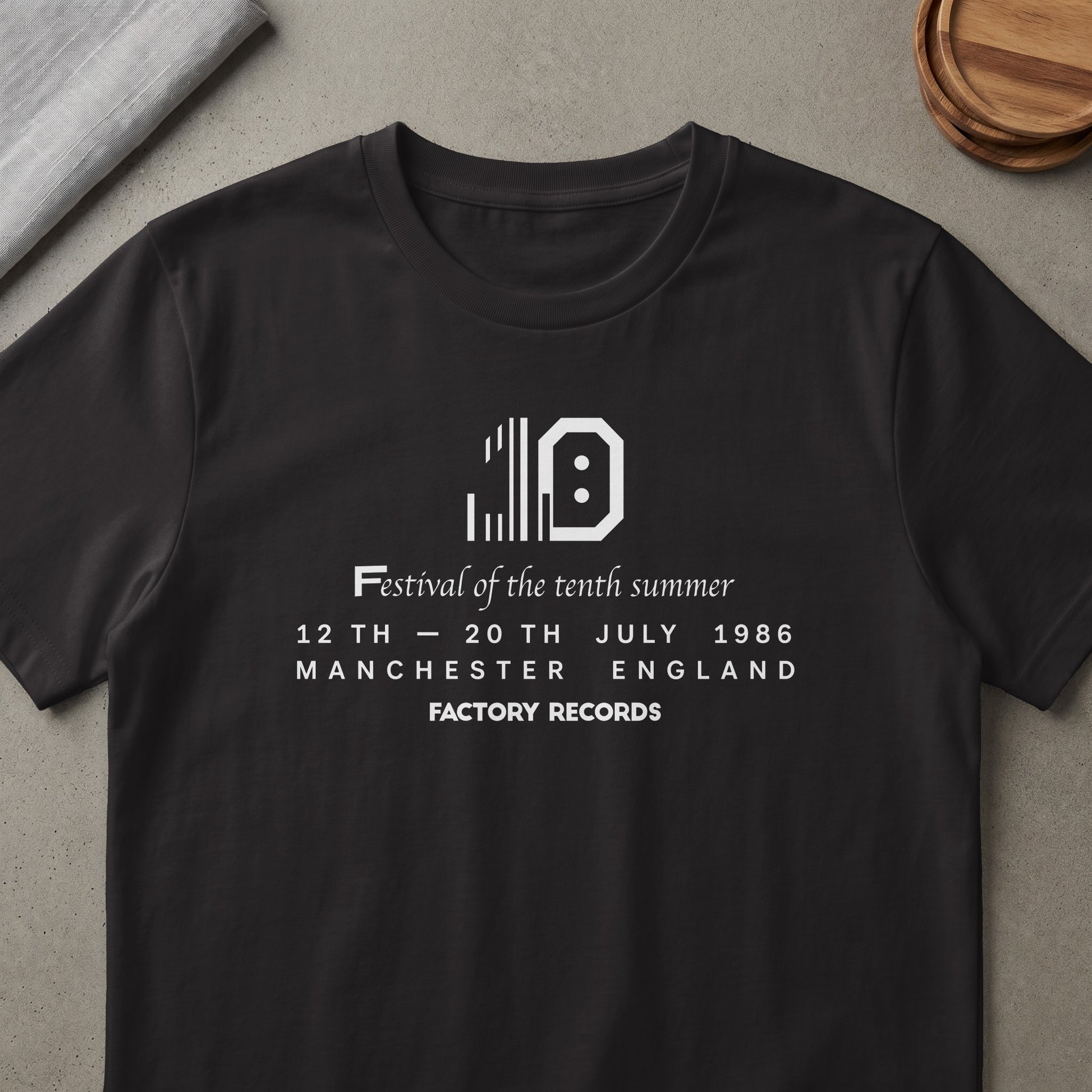 Black t-shirt with white text for Factory Records' tenth summer festival in 1986.