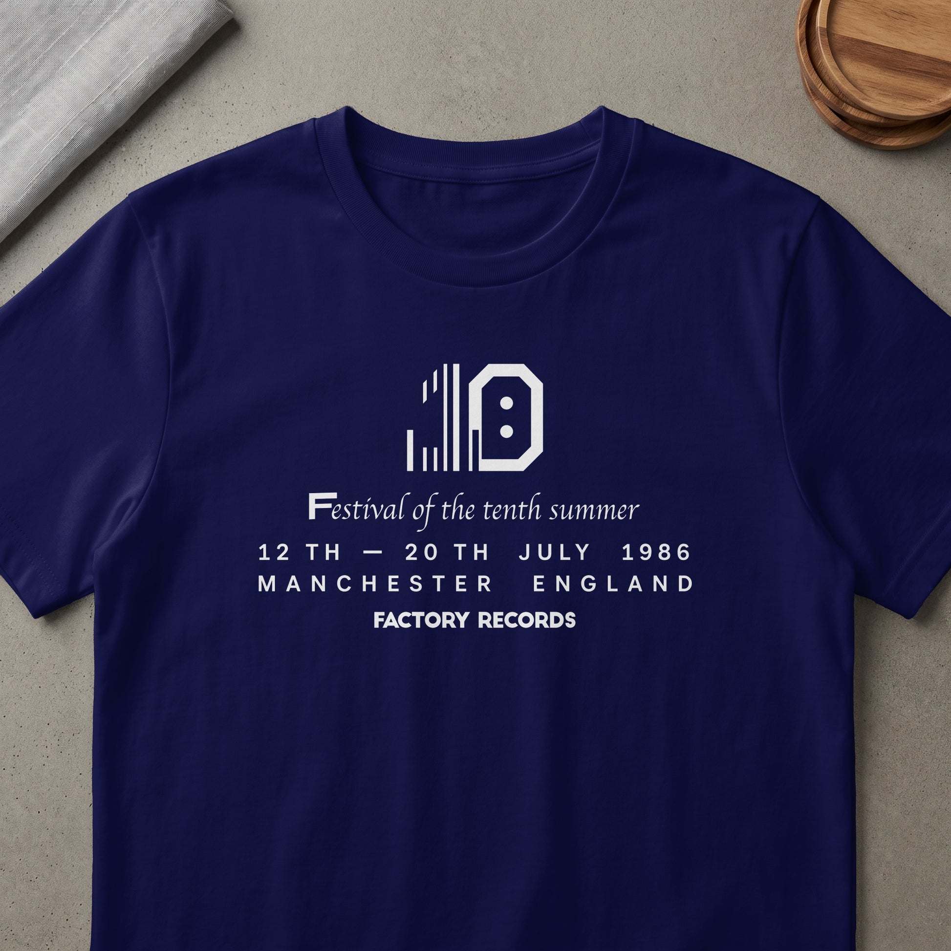 Navy t-shirt with "Festival of the tenth summer 1986 Manchester England Factory Records" text.