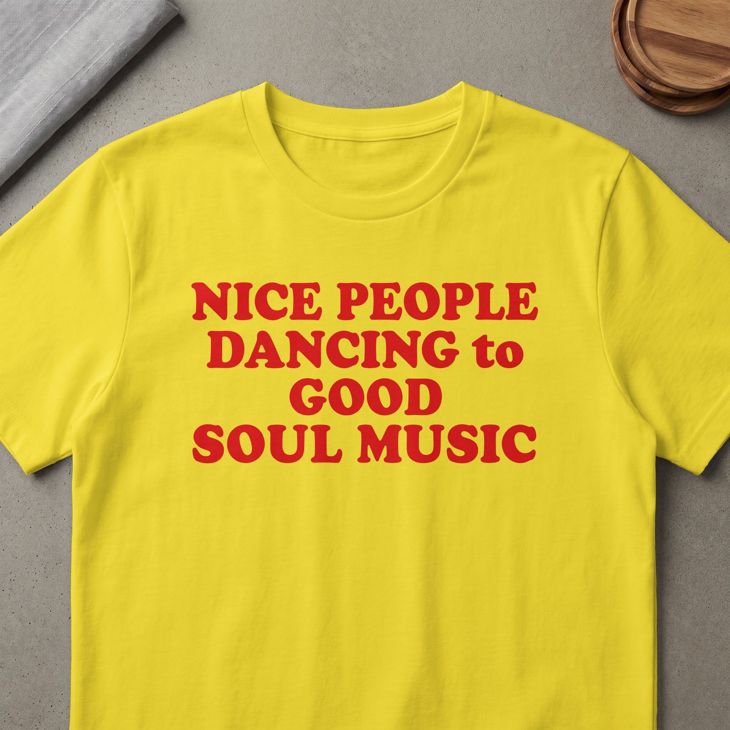 Yellow t-shirt with red text reading "NICE PEOPLE DANCING to GOOD SOUL MUSIC".