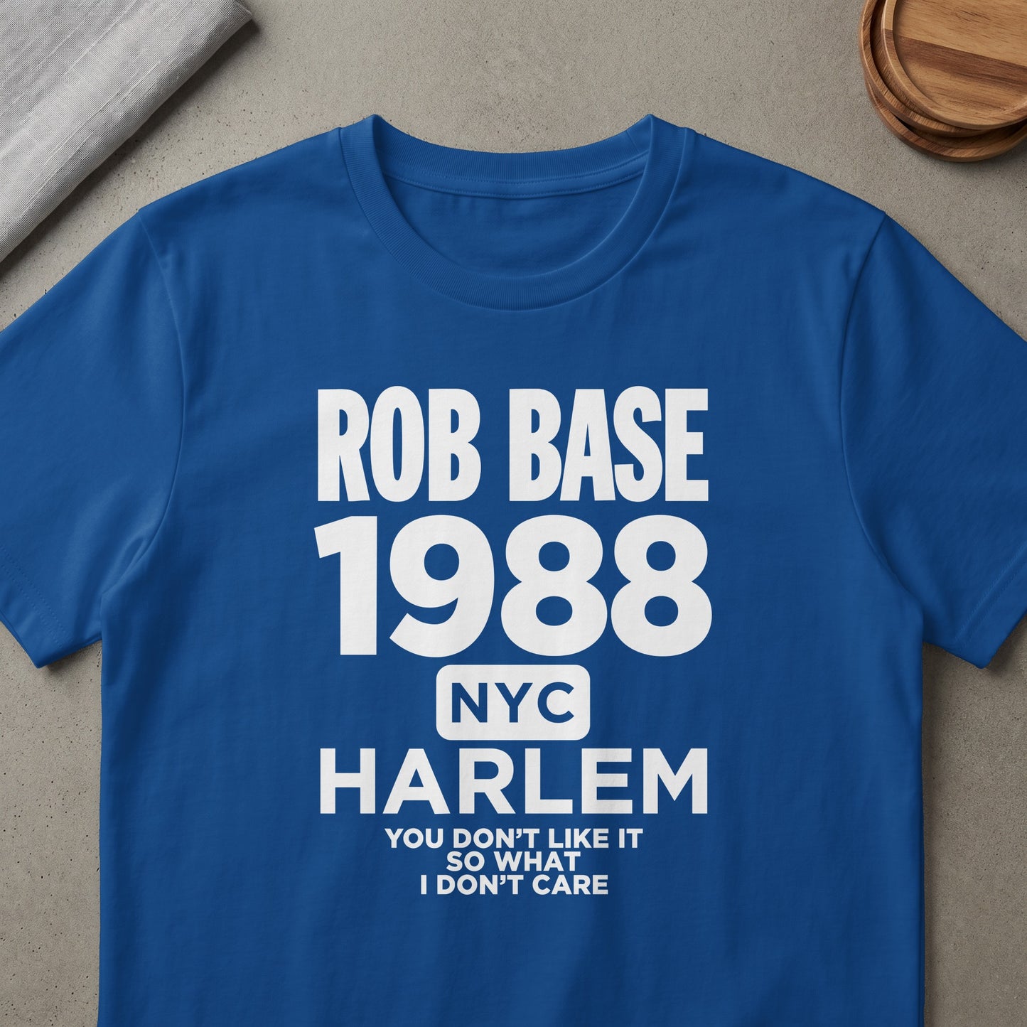 Blue t-shirt with text "ROB BASE 1988 NYC HARLEM YOU DON'T LIKE IT SO WHAT I DON'T CARE".