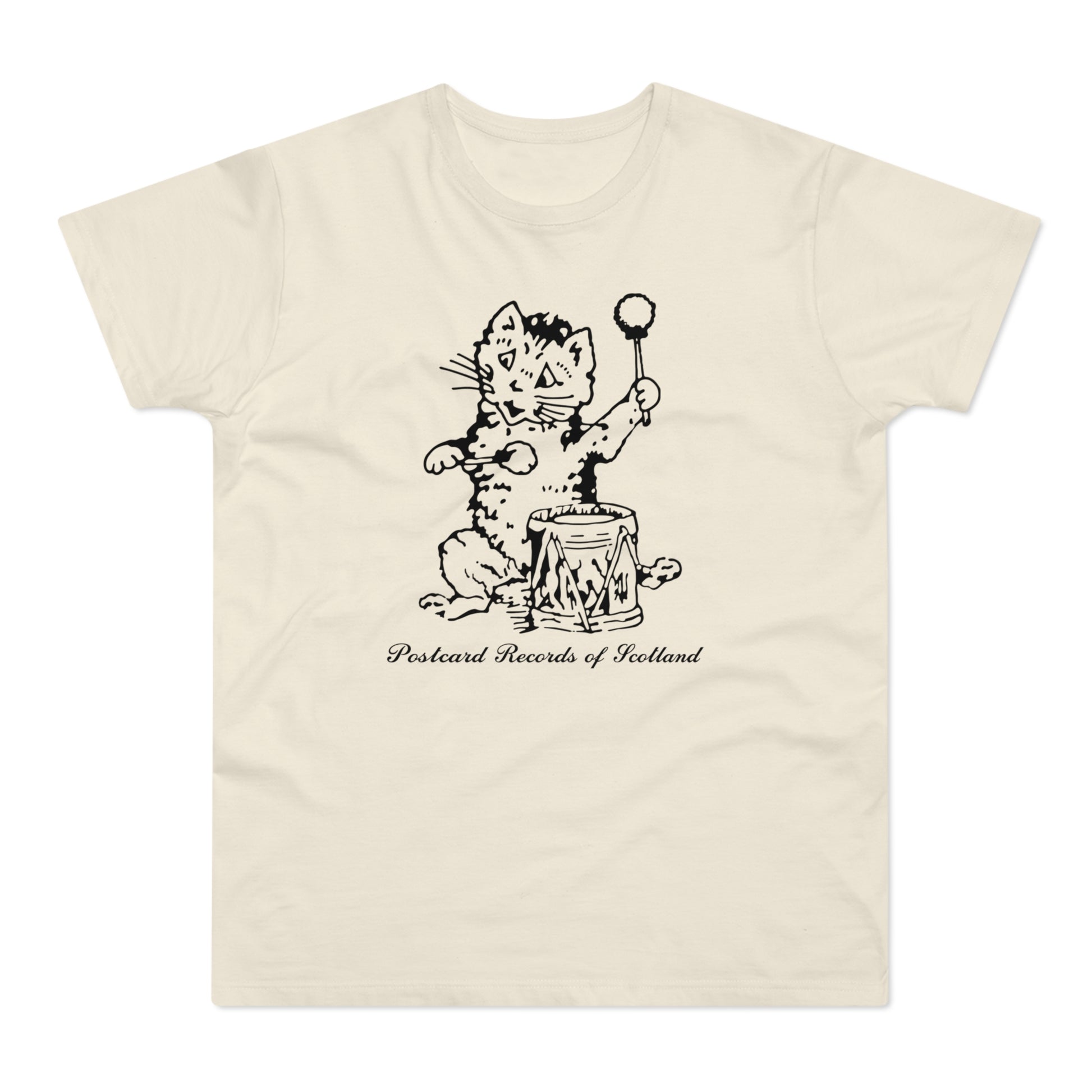 Cream t-shirt with a black, ink-style drawing of a cat playing a drum, with text.