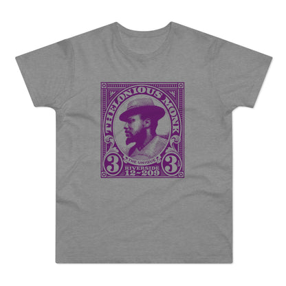 Thelonious Monk portrait featured on a purple postage stamp graphic on a grey t-shirt.