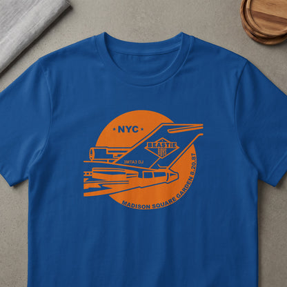 Blue t-shirt with orange Beastie Boys NYC Madison Square Garden concert graphic.