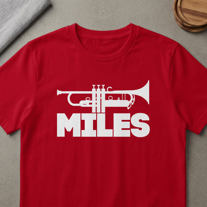 Red t-shirt with white trumpet graphic and the word MILES.