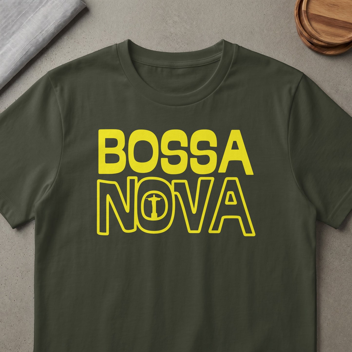 Dark green t-shirt with yellow "BOSSA NOVA" text and Christ the Redeemer icon.