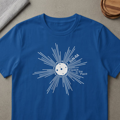 Blue t-shirt with white "Sun-Ra Space is the Place" graphic.