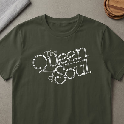 Dark green t-shirt with white text "The Queen of Soul Aretha Franklin".