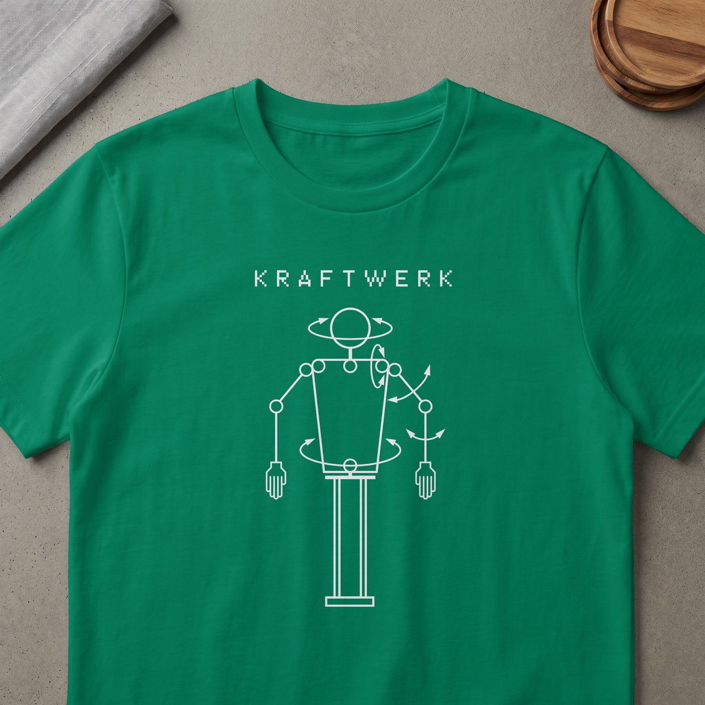 Green t-shirt with white "KRAFTWERK" text and robot diagram.