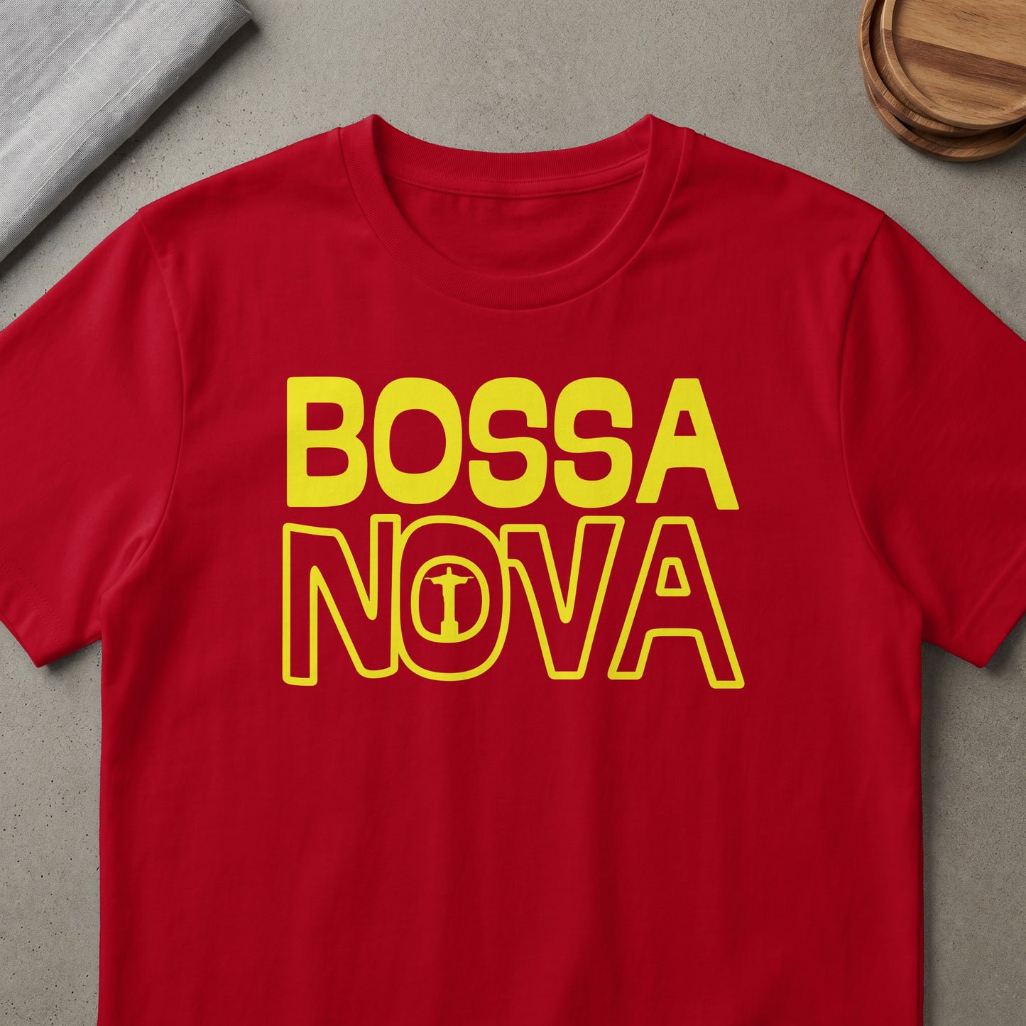 Red t-shirt with yellow text "BOSSA NOVA" and Christ the Redeemer silhouette.