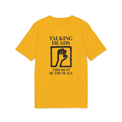 Yellow t-shirt with blue \"TALKING HEADS\" and \"THIS MUST BE THE PLACE\" text and a hand design.
