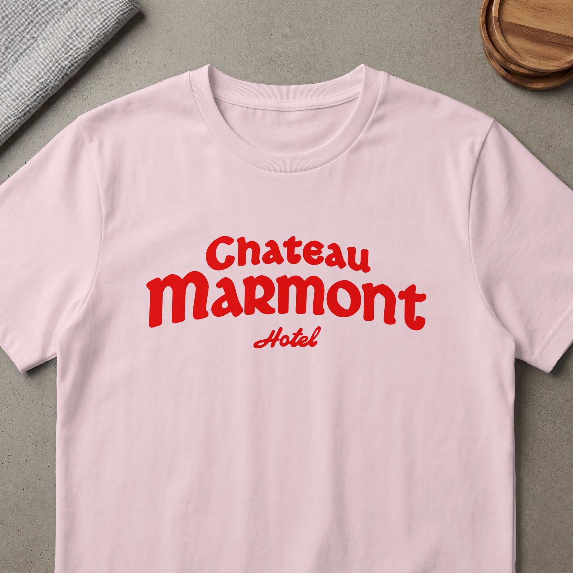 Pink t-shirt with red "Chateau Marmont Hotel" text.