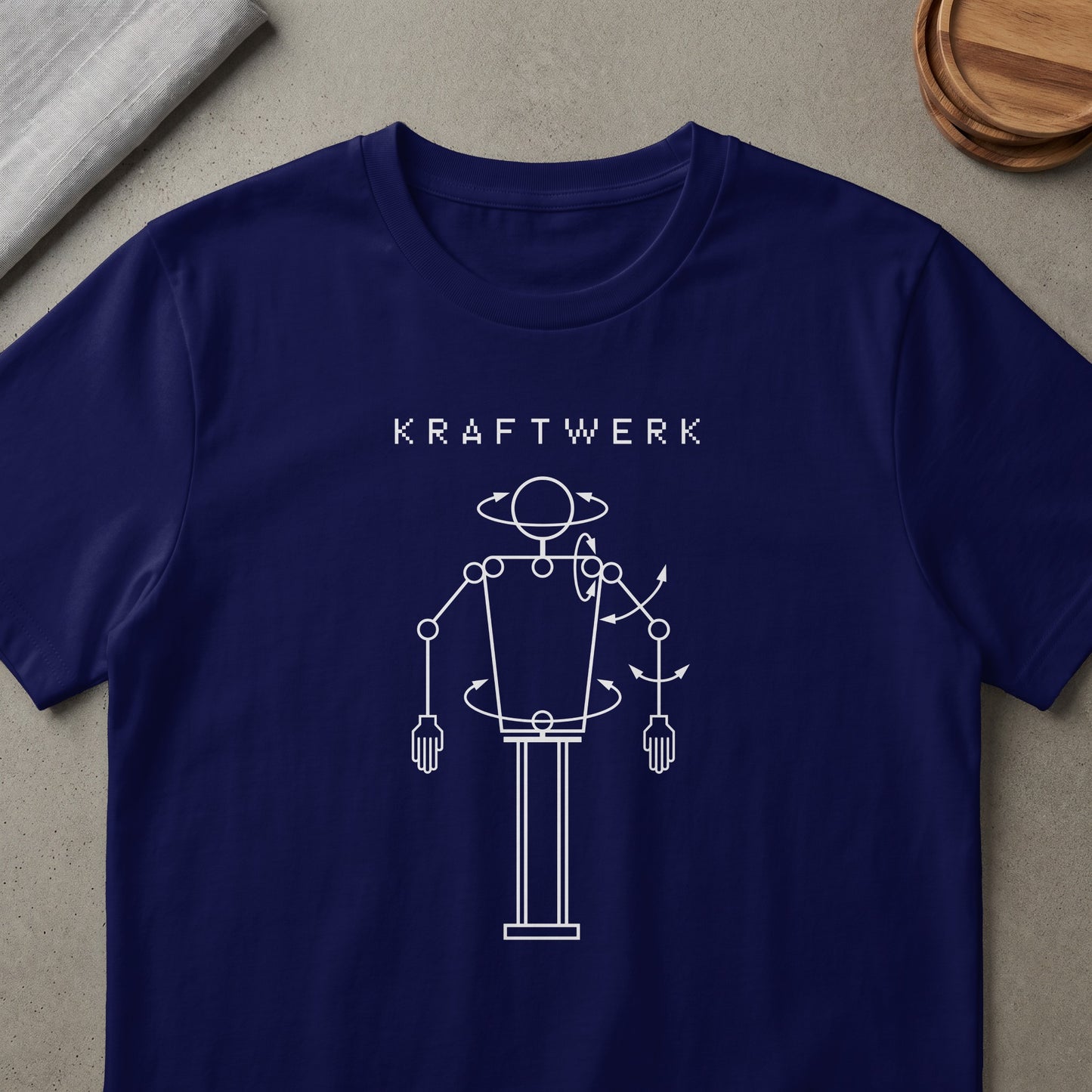 Navy t-shirt with "KRAFTWERK" text and a white line art robot figure.
