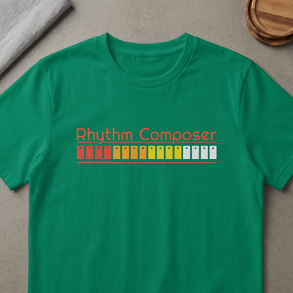 Green t-shirt with orange text "Rhythm Composer" and colorful button pattern.