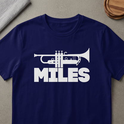 Navy t-shirt with white trumpet graphic and "MILES" text.
