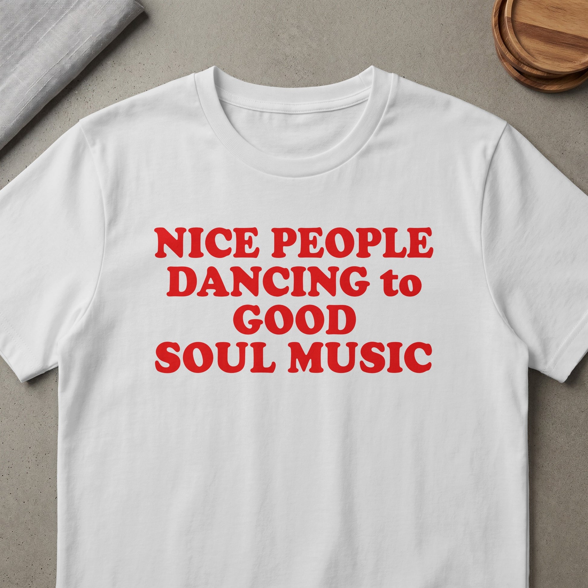 White t-shirt with red text reading "NICE PEOPLE DANCING to GOOD SOUL MUSIC".