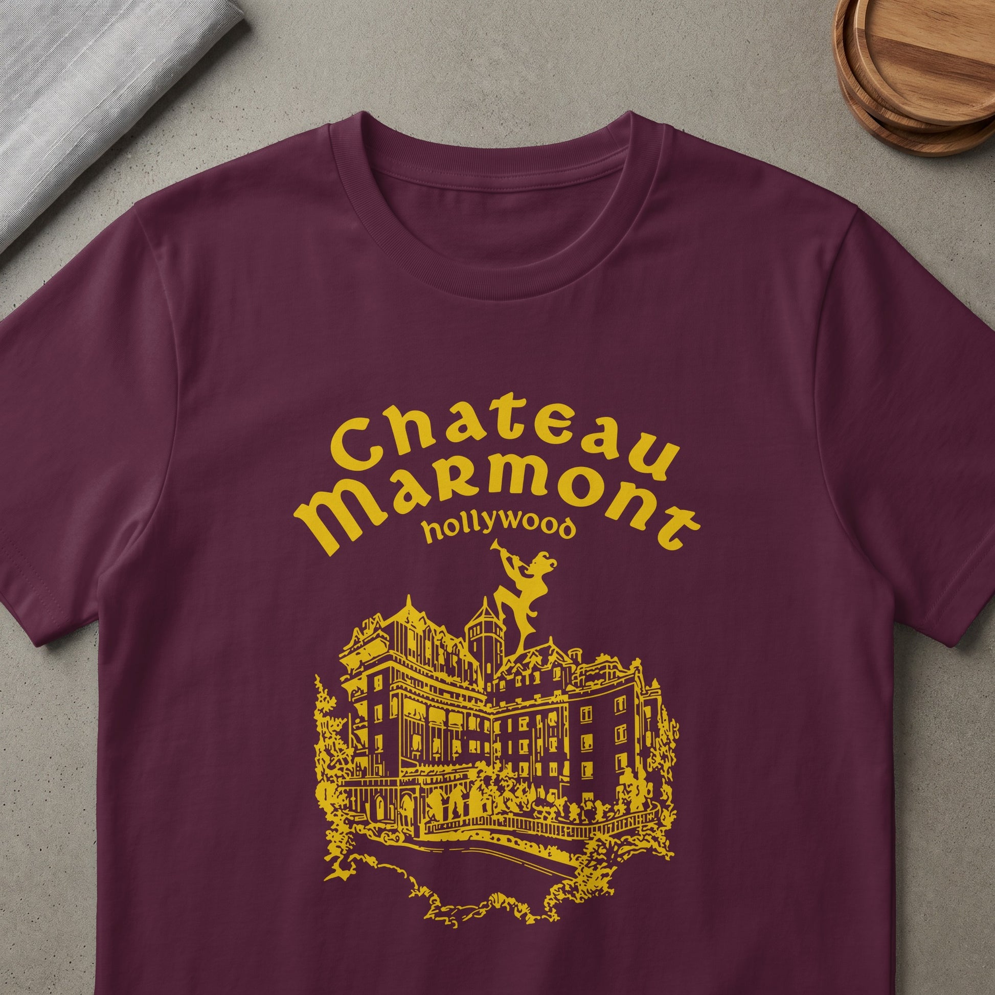 Maroon t-shirt with yellow Chateau Marmont Hollywood text and building graphic.