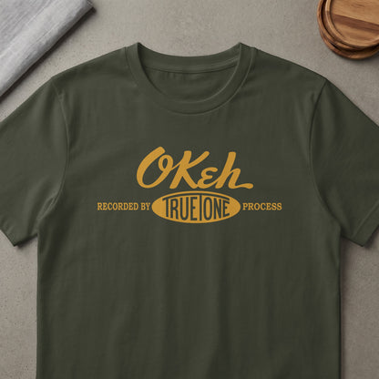 Green t-shirt with yellow text: "OKeh Recorded by TRUE ONE Process".