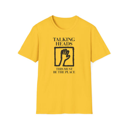 Yellow t-shirt with black "Talking Heads This Must Be the Place" graphic and a hand.