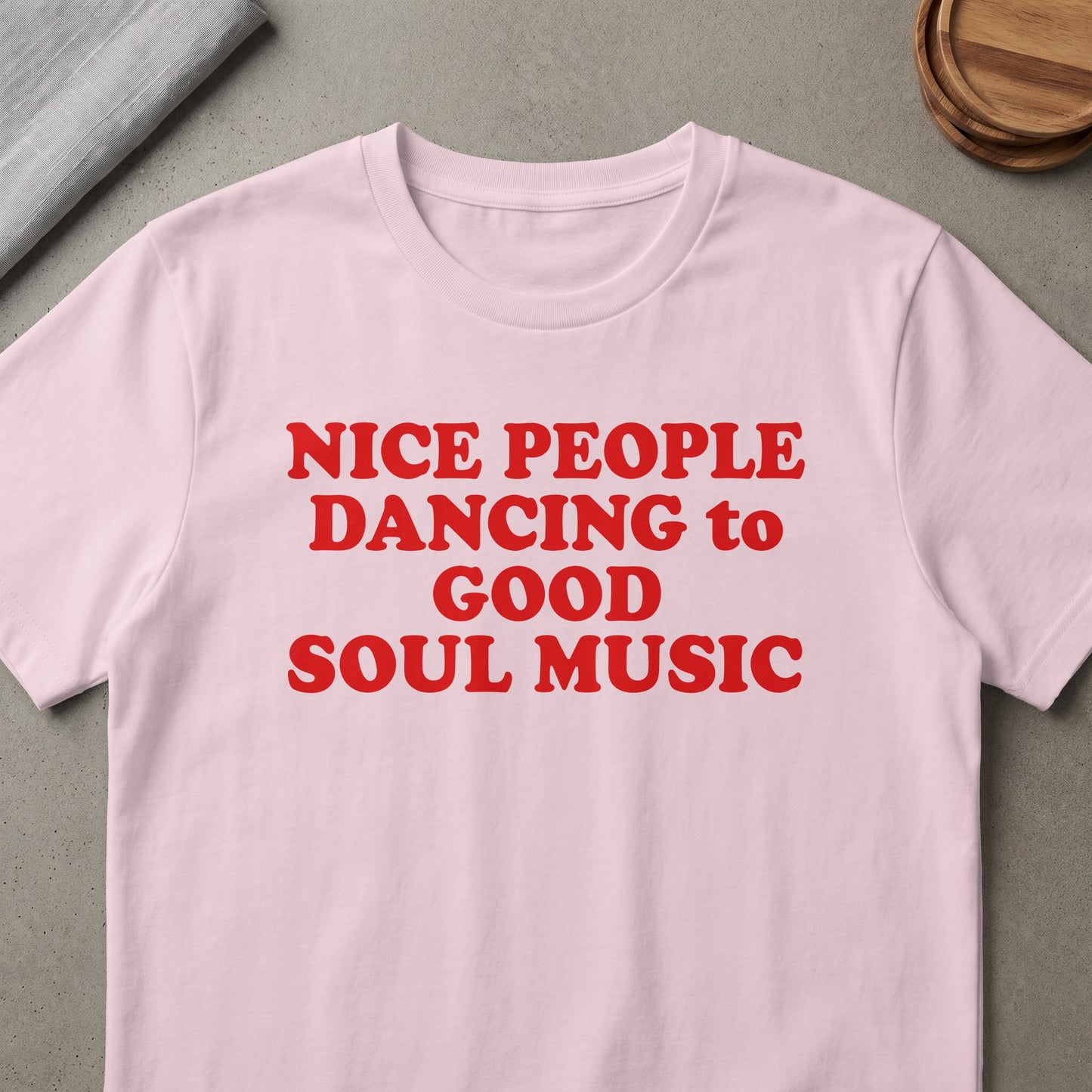 Pink t-shirt with red text reading "NICE PEOPLE DANCING to GOOD SOUL MUSIC".