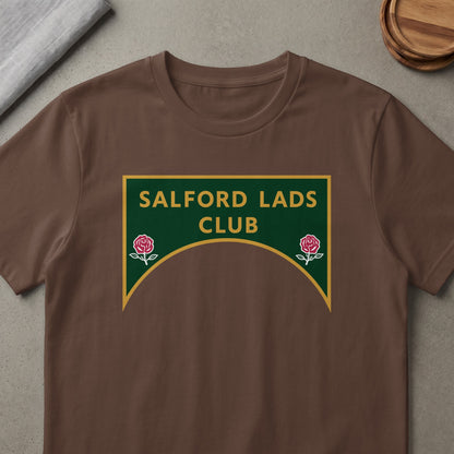 Brown t-shirt with green and gold "SALFORD LADS CLUB" text and two roses.