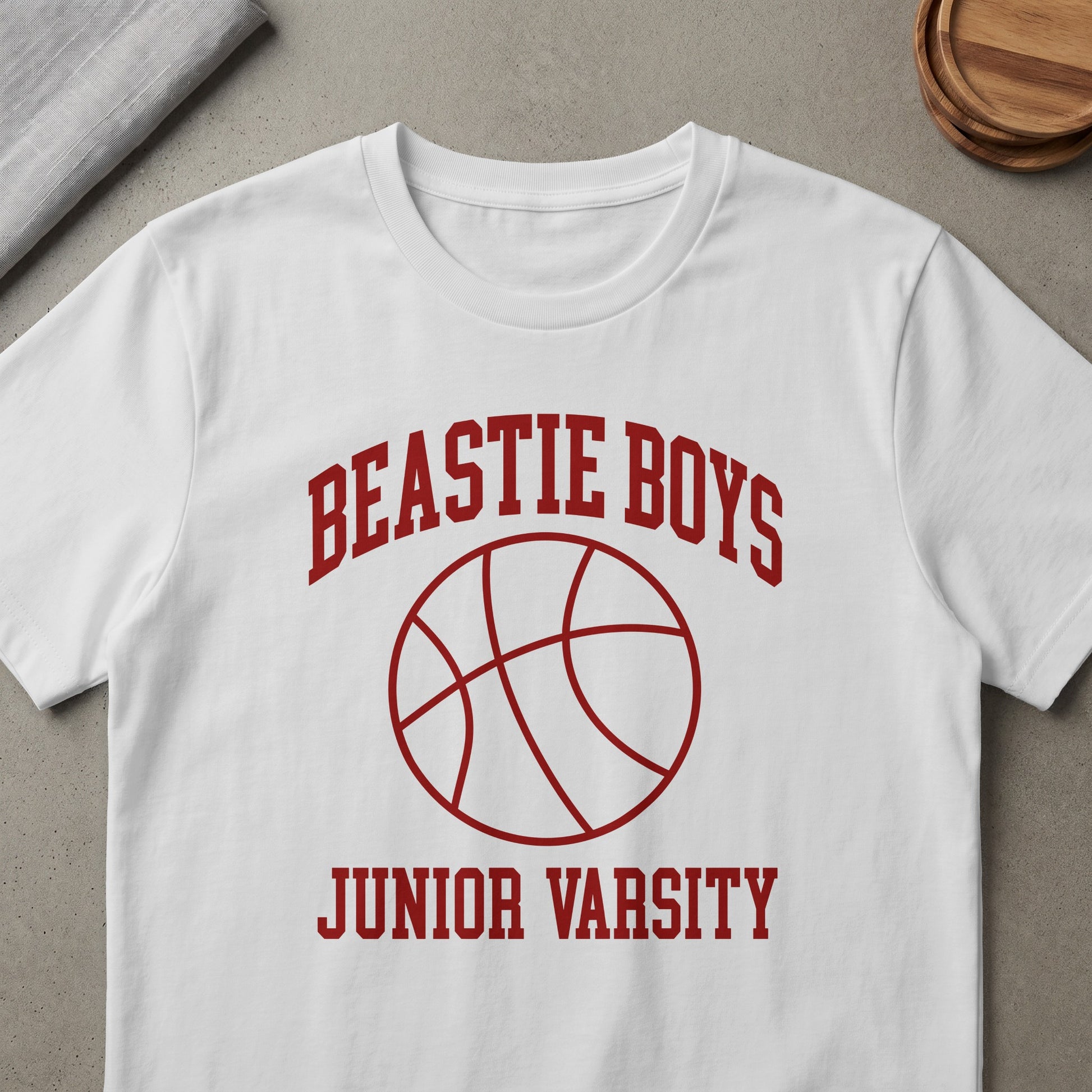 White t-shirt with "Beastie Boys Junior Varsity" and basketball graphic.