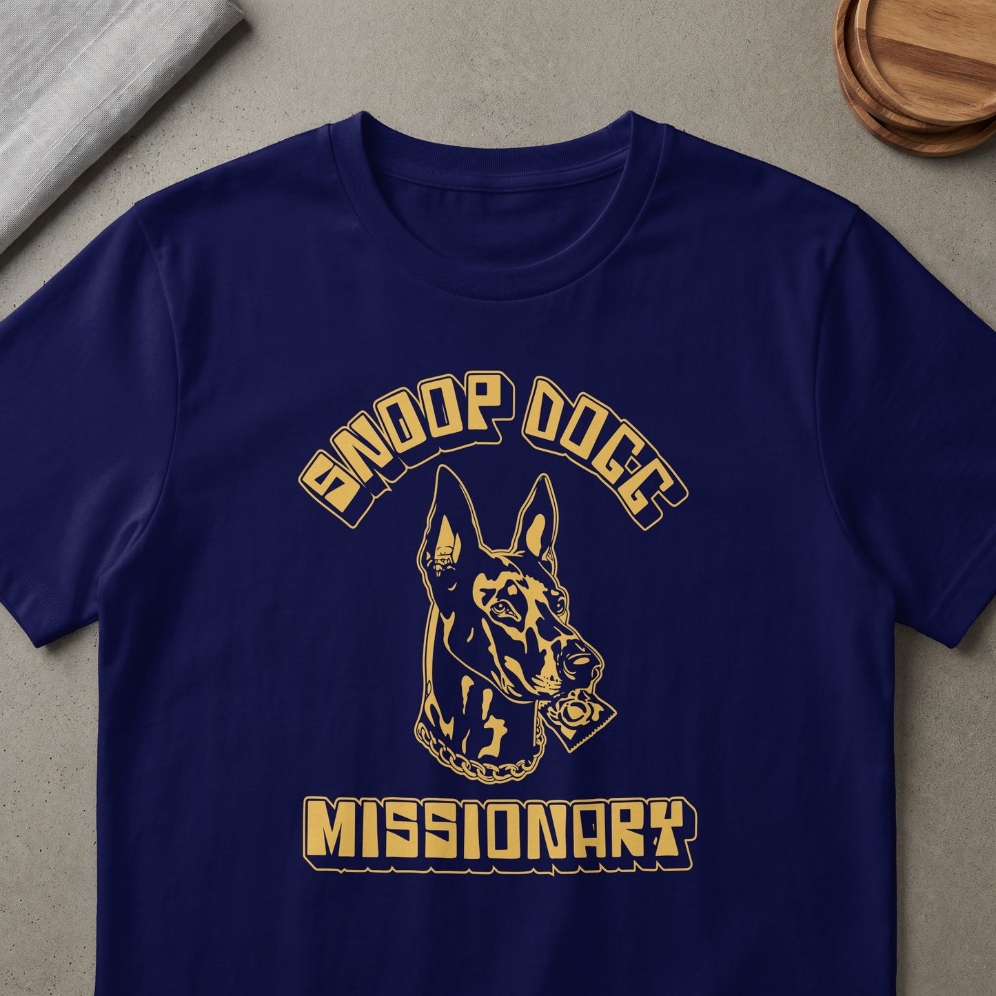 Navy t-shirt with gold Snoop Dogg text and a dog holding a condom.