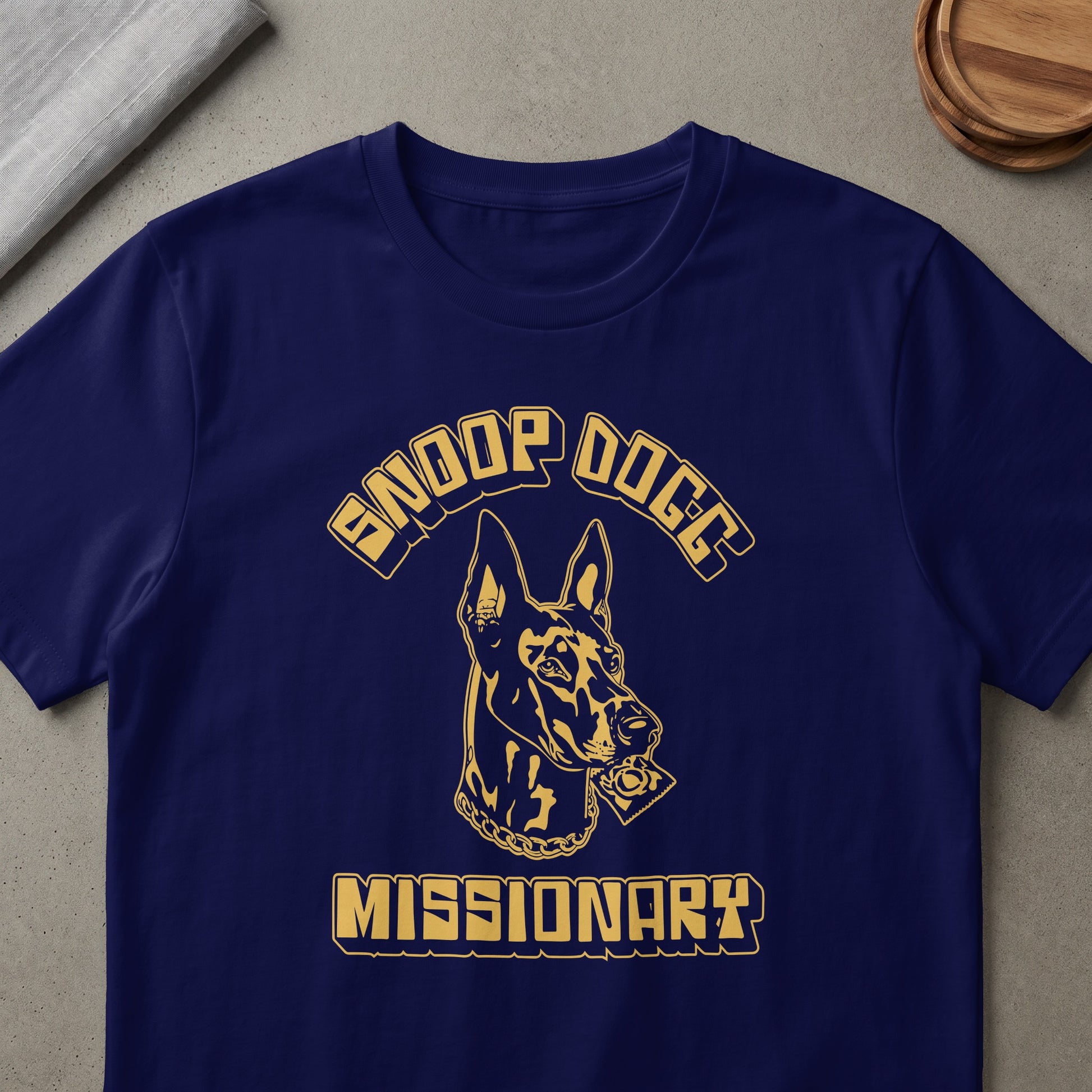 Navy t-shirt with gold Snoop Dogg text and a dog holding a condom.