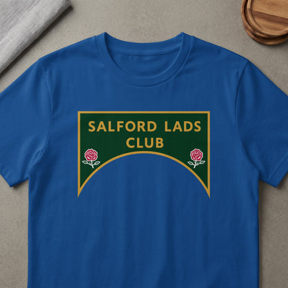 Blue t-shirt with Salford Lads Club logo featuring roses.