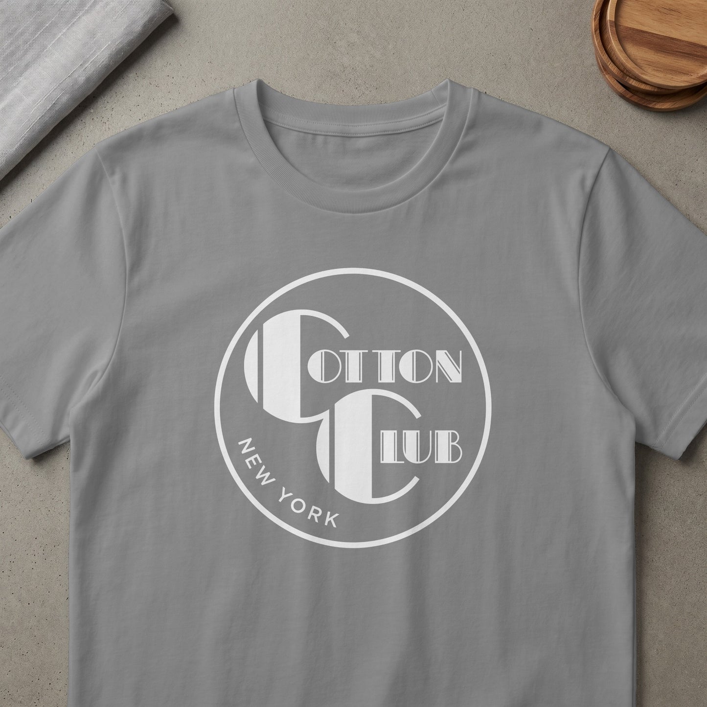Grey t-shirt with white Cotton Club New York logo graphic.