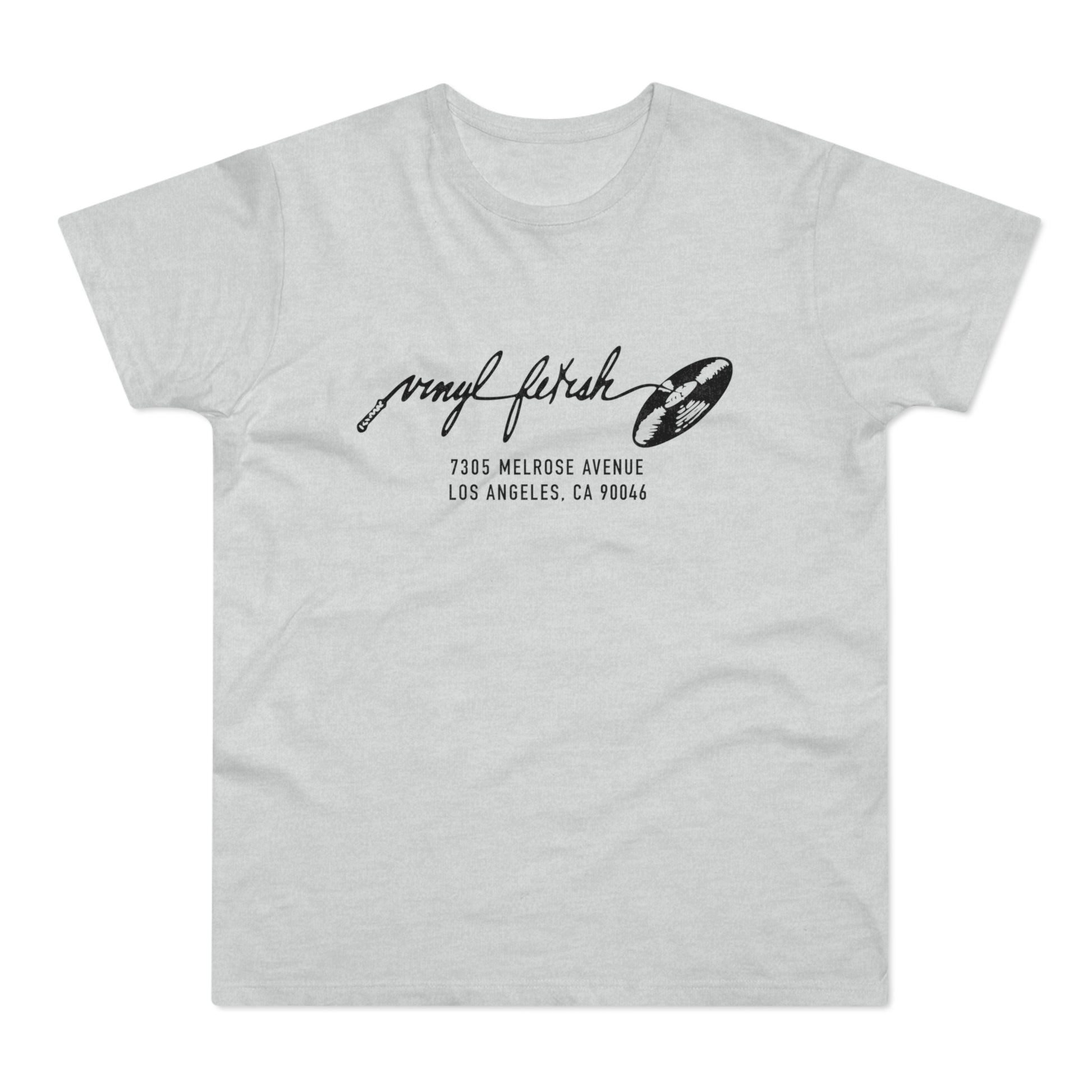 Light gray t-shirt with black text "vinyl fetish" and address 7305 Melrose Avenue Los Angeles, CA 90046.